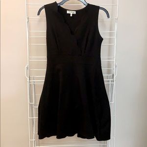 Black scalloped neck mini dress